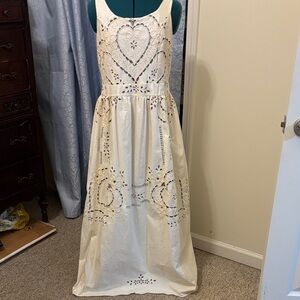 Elegant Cream Maxi Dress with Heart Cut-Outs